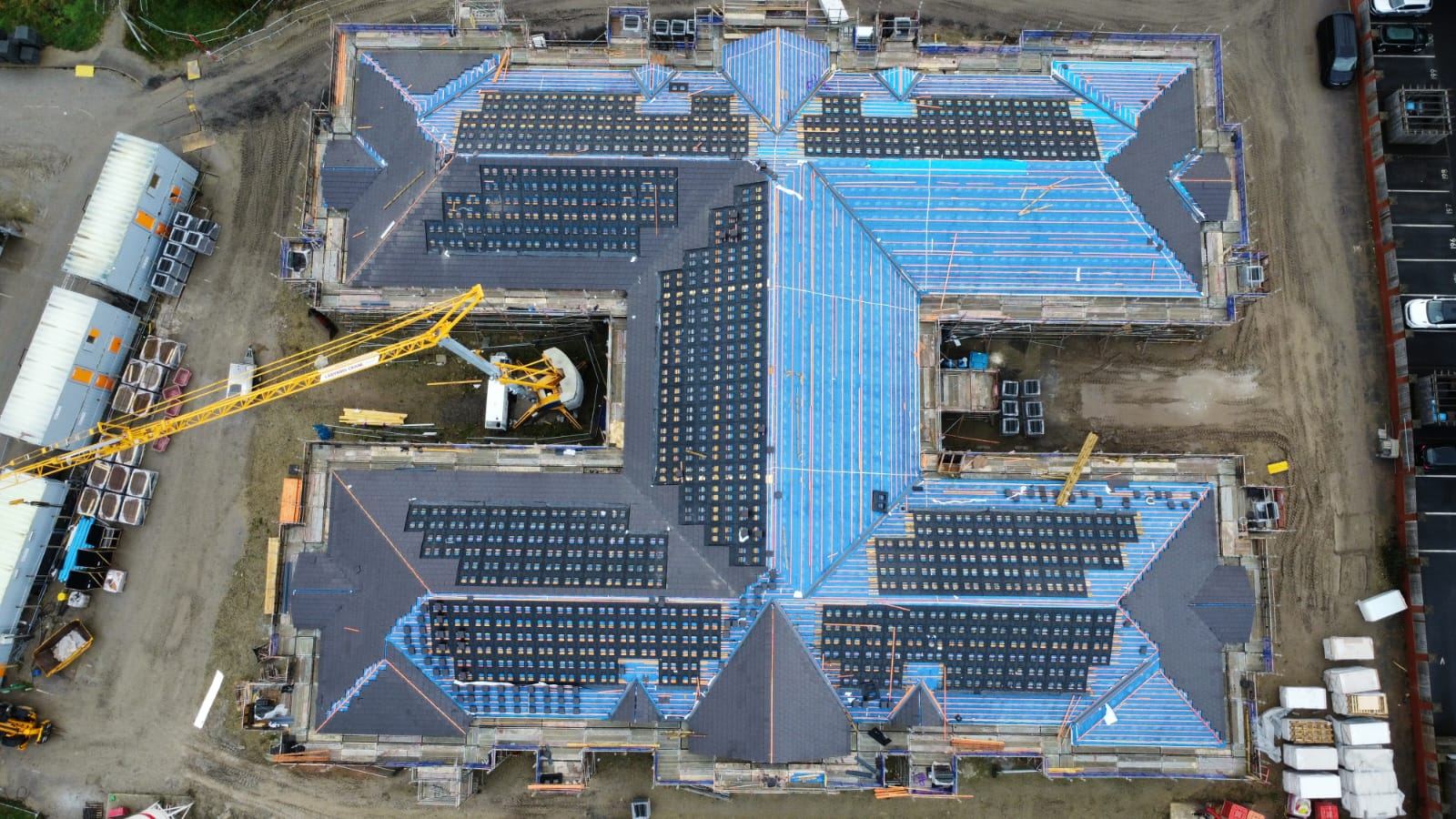 Large commercial roof project in progress from above